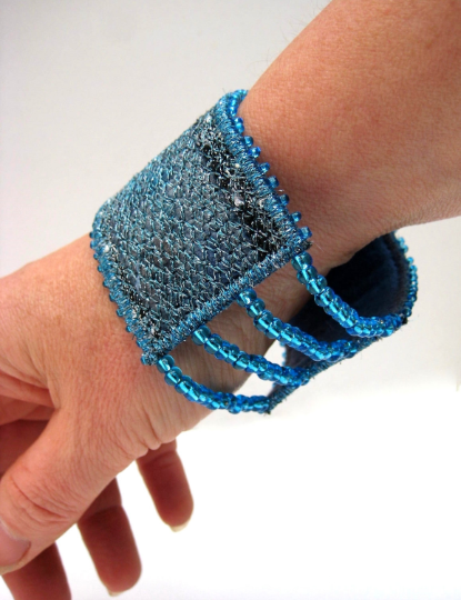Artisan textile art jewellery with elasticated blue beads