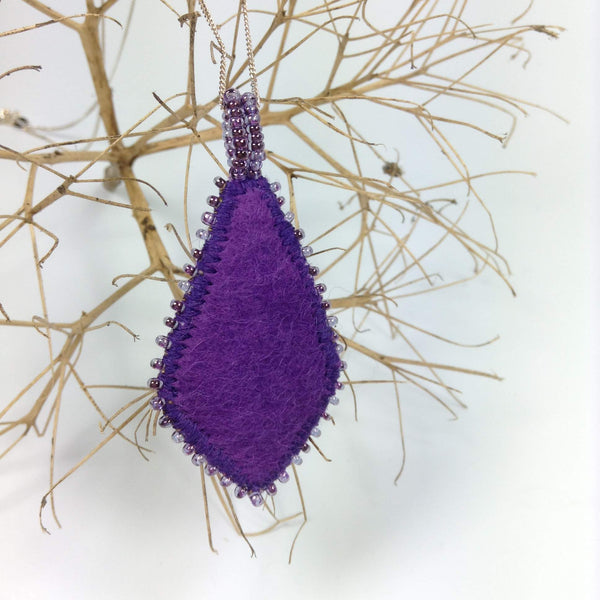 Purple soft felt backing of embroidered pendant necklace