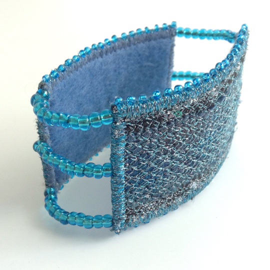 Felt lined for comfort a panelled stitched and beaded cuff bracelet